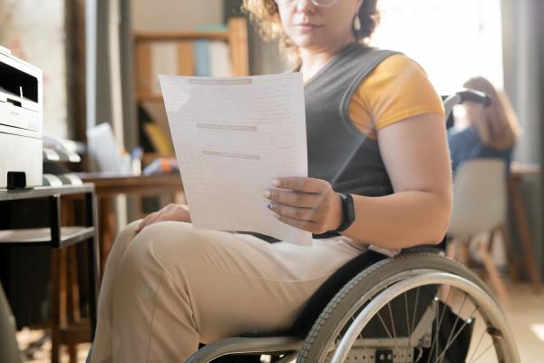 Woman using a wheelchair at work